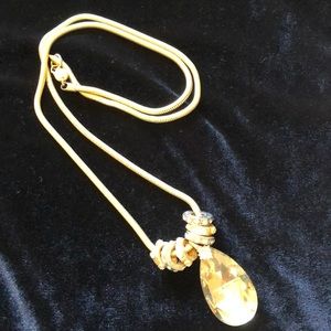 Gold tone necklace with teardrop pendant